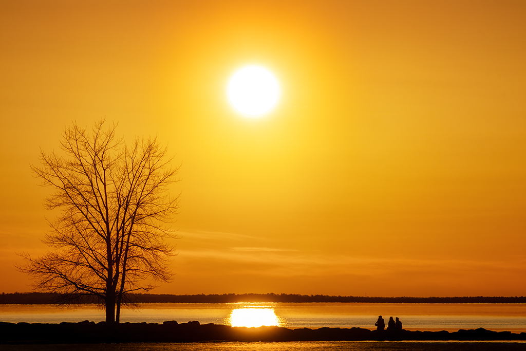 Whispering waves and golden rays — a sunset that paints dreams upon the Ottawa River's still canvas. Britannia Beach, Ottawa, Ontario